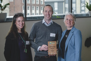 Jilly Scheepers (left) and David Bacon (centre) receive the Exeter Sustainability award in the Community Group/ Charity/Non Profit category 