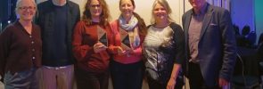 The ECOE team holds two awards won at the Community Energy England ceremony